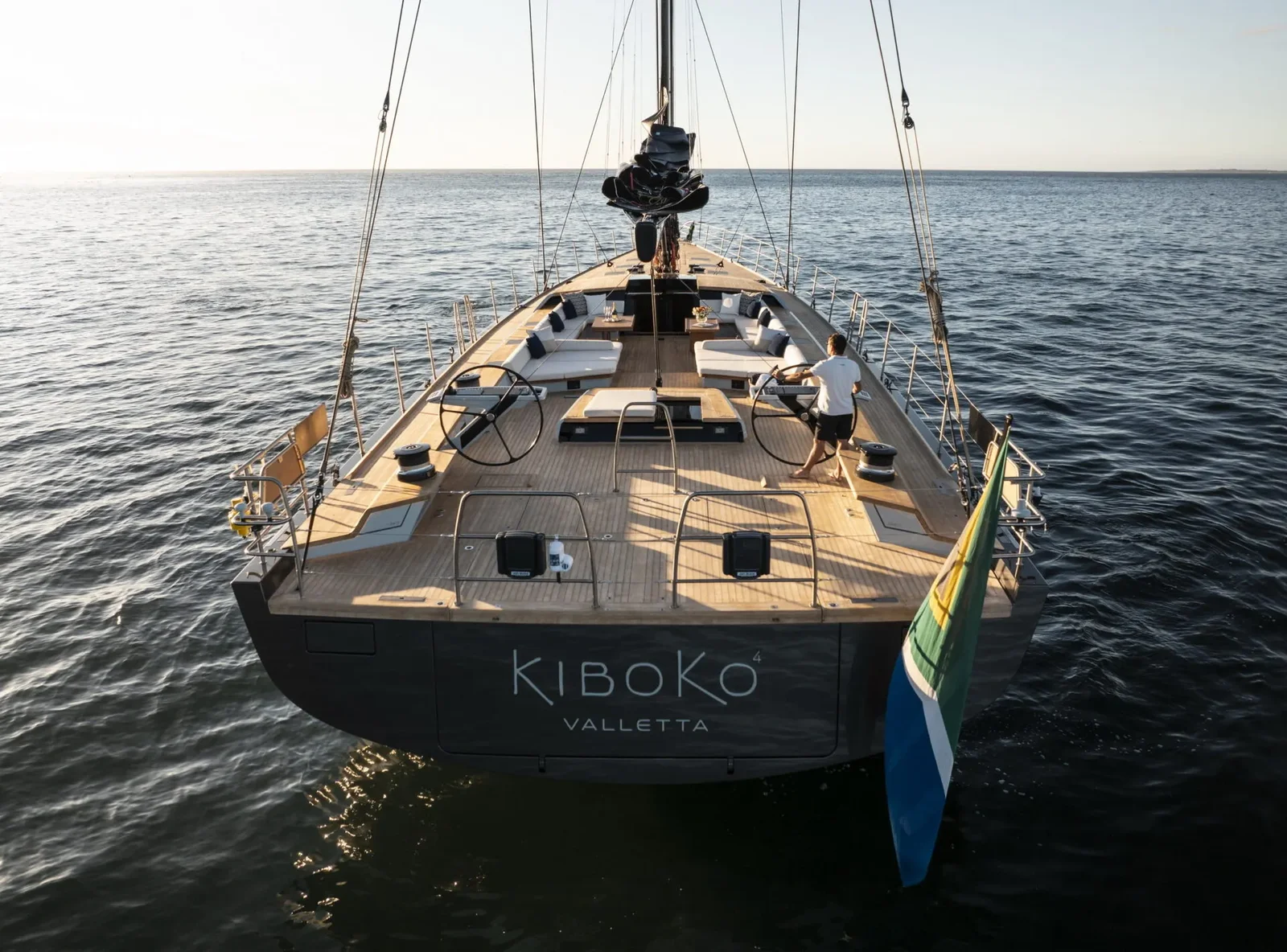 Kiboko 4 — stern view showing boat name at golden hour